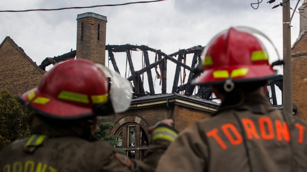  Firefighters work to put out a blaze at St. Anne's Anglican Church in Toronto's west end on Sunday, June 9, 2024. (Cole Burston/The Canadian Press) 